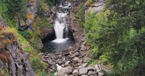 A small, yet powerful waterfall tumbles into a natural pool in Idaho's mountains.
