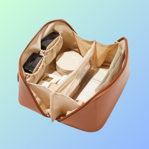 A stylish, open cosmetic bag filled with various beauty products and organized compartments on a gradient background.