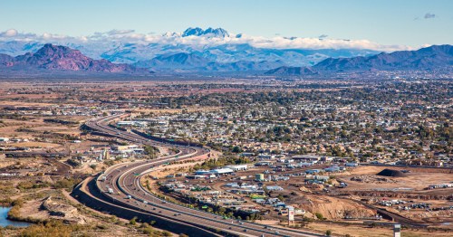 aerial shot of mesa, arizona with mountains in the background