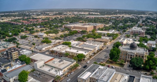 aerial shot of georgetown texas and its city blocks and parks