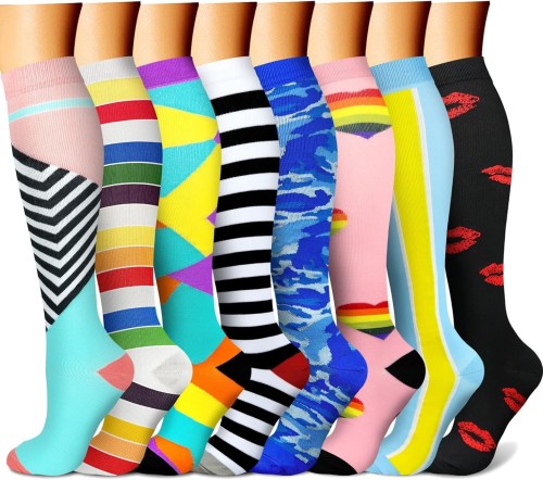 A variety of colorful knee-high socks displayed in a row, featuring different patterns and designs.