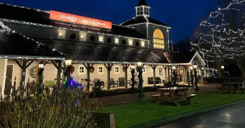 exterior of the yankee candle village adorned with christmas lights in south deerfield ma