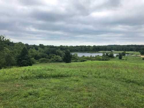 A historic mound hides under a grassy landscape in Ohio.