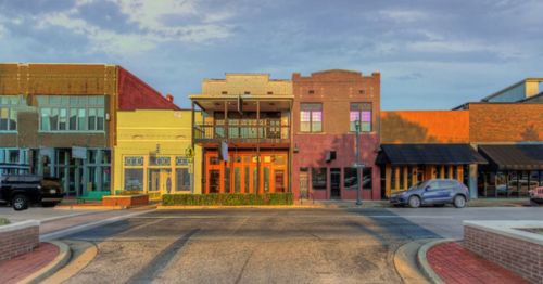 Historic downtown district of Jonesboro, Arkansas, with the street lined with quaint shops.