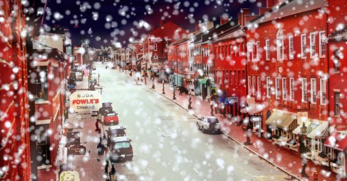 snow falls over downtown newburyport massachusetts at night