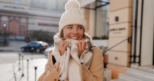 A woman bundled up in winter clothing.