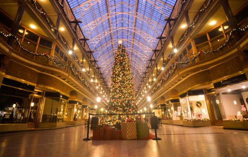 The Old Arcade in Cleveland -- a Victorian shopping mall that many consider the first in the nation -- featuring a Christmas tree under its grand skylight.