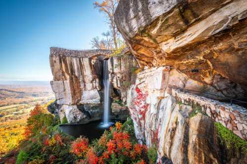 The picturesque landscape of Rock City with Lover’s Leap in the background and the waterfall in the foreground.