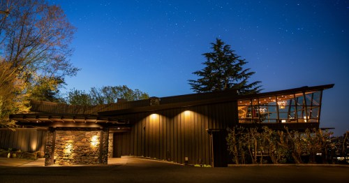 The exterior of Canlis, a fine-dining restaurant in Seattle at night.