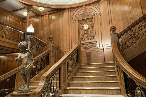 A re-creation of the Titanic's grand staircase featured in Boston's "TITANIC: The Artifact Exhibition." The elaborate staircase is made from wood.