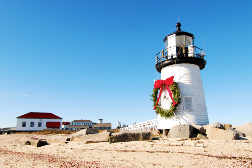 A large Christmas wreath adorns the Brandt Point Lighthouse in Nantucket, Massachusetts.