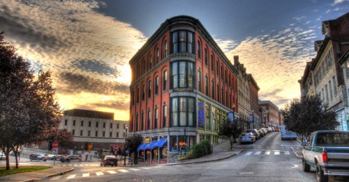 A brick building on a street corner.
