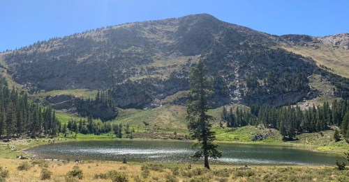 Looking toward a small lake nestled up against a mountain in New Mexico.