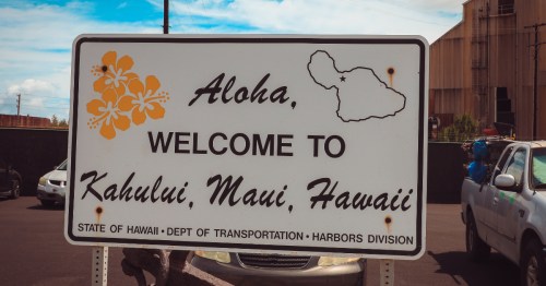 A "Welcome to Kahului, Maui, Hawaii" sign, greeting visitors to this up-and-coming island hub.