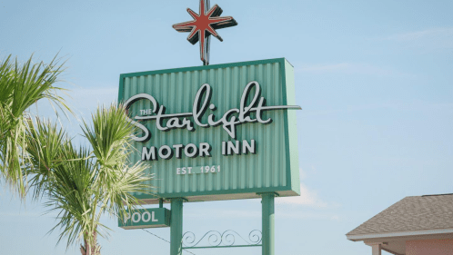 Vintage motel sign reading "Starlight Motor Inn"