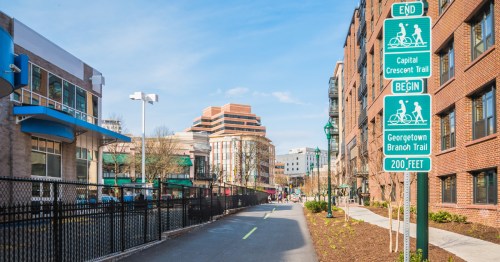 a bike path runs through the city of Bethesda maryland on a sunny day