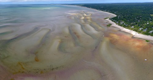 aerial shot of the brewster tidal flats, a mile of sand that appears during low tide on cape cod