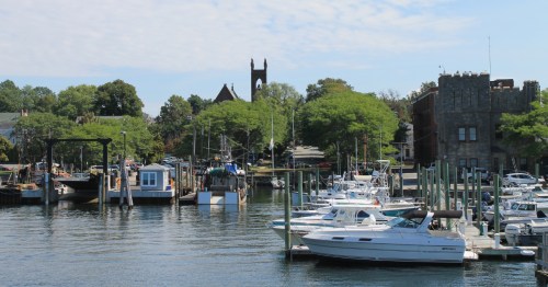 view of a marina in bristol, rhode island, on a sunny day