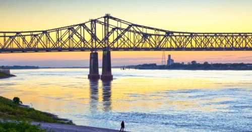 A colorful sunset over the Mississippi River and the Natchez-Vidalia Bridge in Natchez.