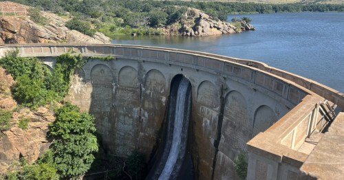 aerial view of a dam with a waterfall in oklahoma