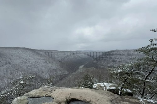 The New River Bridge spans over the entire gorge which is beautifully dusted with a layer of fresh snow.