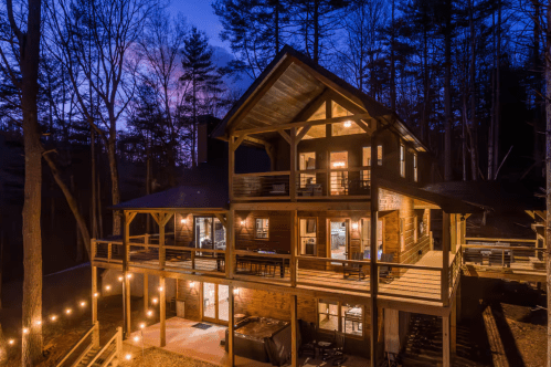 Exterior of a luxury cabin Airbnb at night in Cherry Log, Georgia
