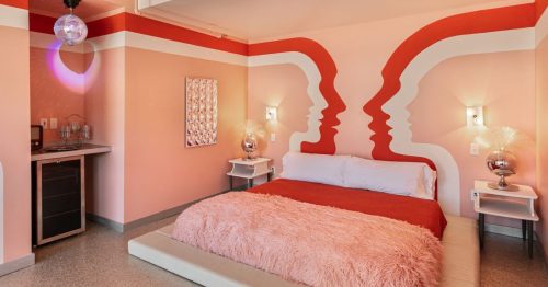 A vibrant pink motel room at The Dive in Tennessee.