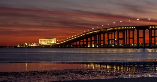 sunset view of Biloxi Bridge in Mississippi