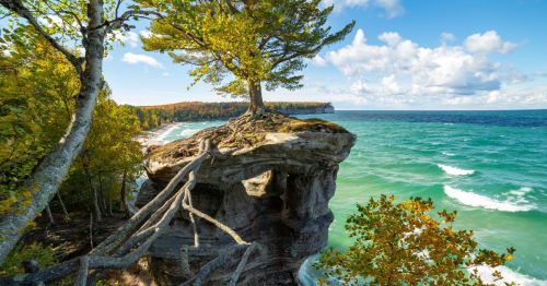 view of Chapel Rock and Lake Superior in Michigan on a bright sunny day