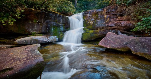 Cedar Rock Falls in the Pisgah National Forest is located on the pathway of the John Rock Trail Loop.