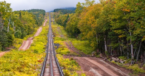 Railroad tracks in the White Mountains of New Hampshire going to the summit of Mount Washington.
