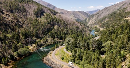 Beautiful view of the mountains and a large river from a bird's eye view in Detroit, Oregon