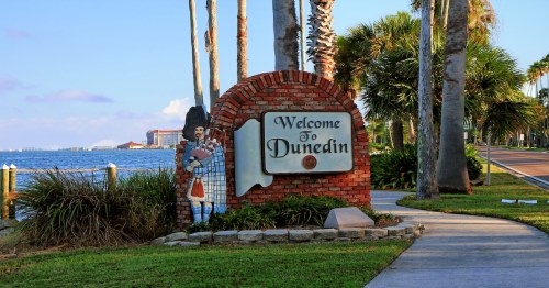 Decorated sign on the border between Dunedin and Clearwater welcoming the city of Dunedin Pinellas County, Florida, United States