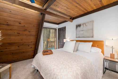 View of a bedroom in the Ozark Treehouse Airbnb in Missouri.