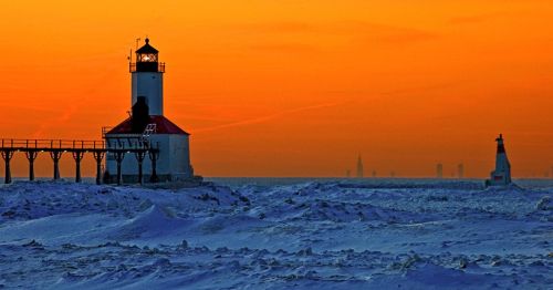 Sunset on Lake Michigan in Indiana during a snowy winter.
