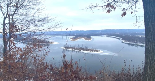 * Snow can be seen on the ground and on islands in the main channel of the Mississippi River near McGregor, Iowa.