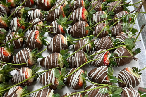 close-up view of long-stem chocolate covered strawberries in a Kentucky chocolate shop