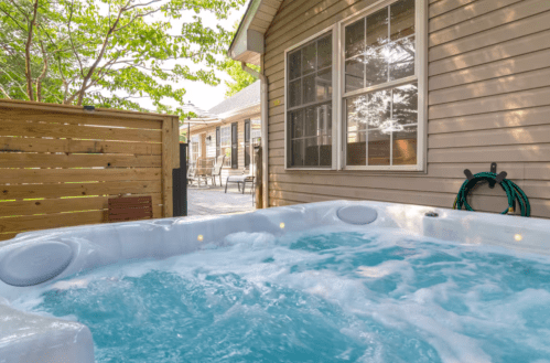 Rehoboth Beach Airbnb: Relaxing hot tub with a private backyard patio.