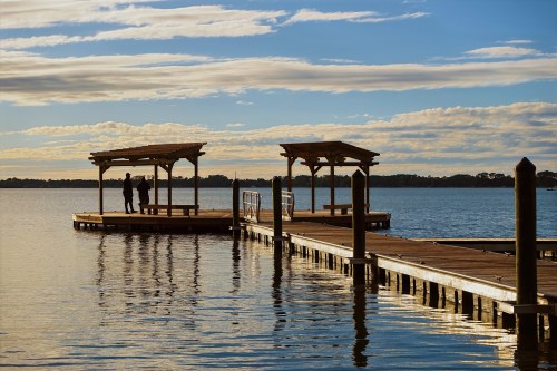 a wooden dock on a lake in mount dora florida