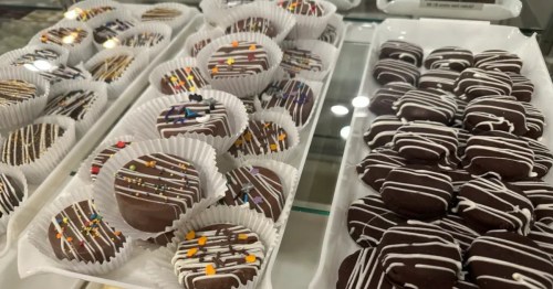 Trays of chocolate covered Oreos.