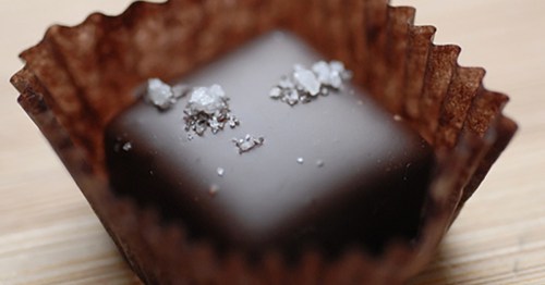 Ragged Coast Chocolates: Sea salt caramel close-up in a paper cup.