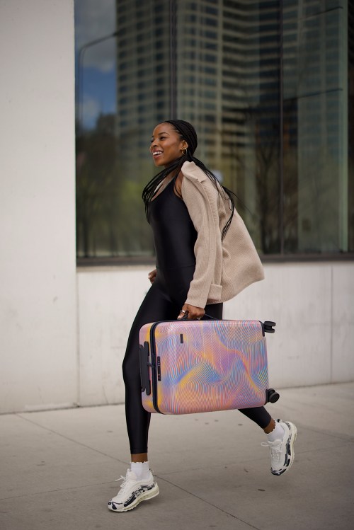 Woman running with suitcase