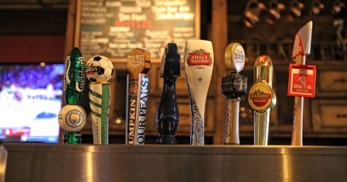closeup of beer taps at Tim Finnegan's Irish Restaurant & Pub in Glendale AZ