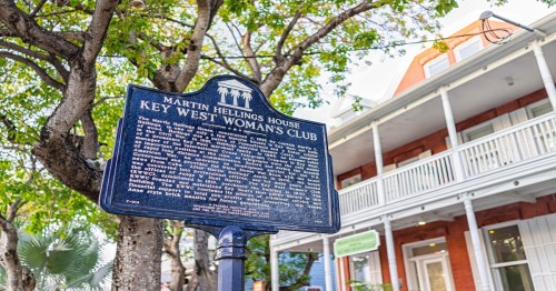 a blue sign of martin hellings house key west woman's club
