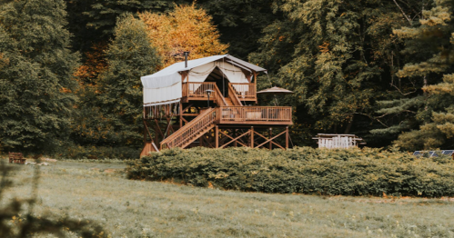 Glamping in Vermont: Elevated tent cabin Airbnb with a scenic autumn view.