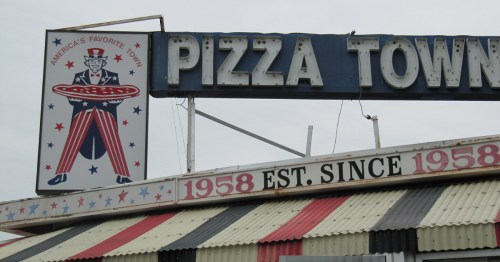 The sign for Pizza Town USA in New Jersey