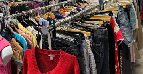 Wide variety of clothing is displayed on racks at a thrift store in Maine.