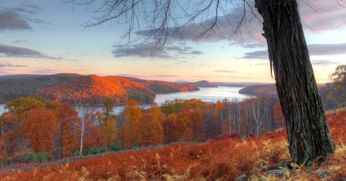 A colorful autumn view looking downward at the Quabbin Reservoir in Massachusetts.