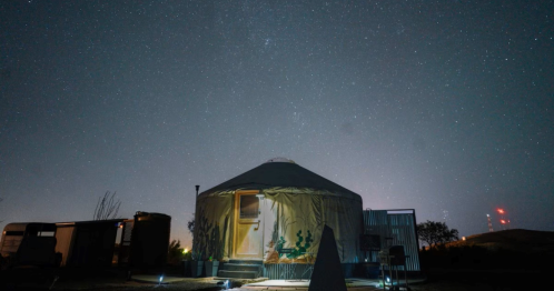 a photo of a yurt airbnb in texas under the bright stars in the night sky