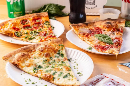 Slices of pizza on table